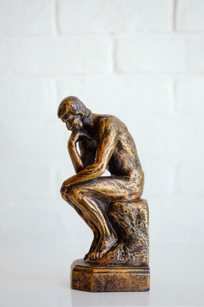 An image of a thinker which headlines a blog describing how thinking and meditation can co-exist successfully